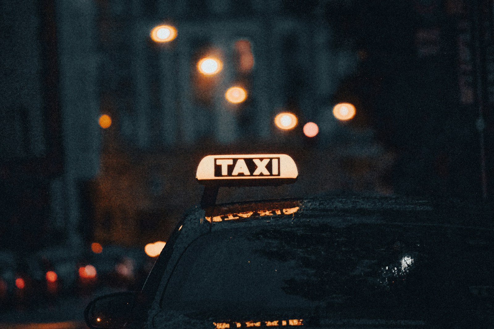 black car on road during night time